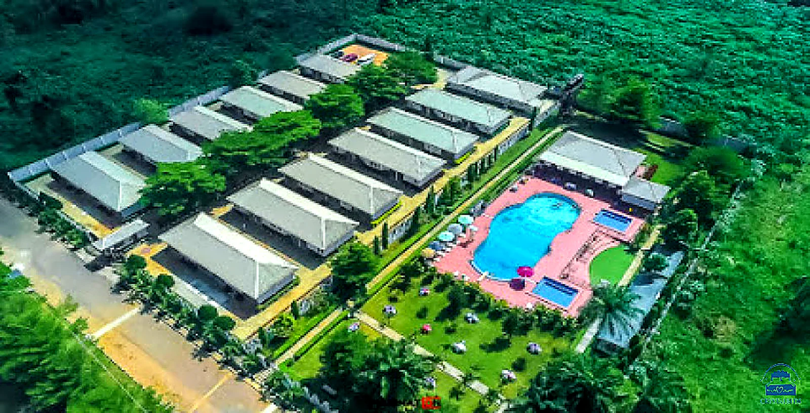 Aerial view of resort buildings and pool